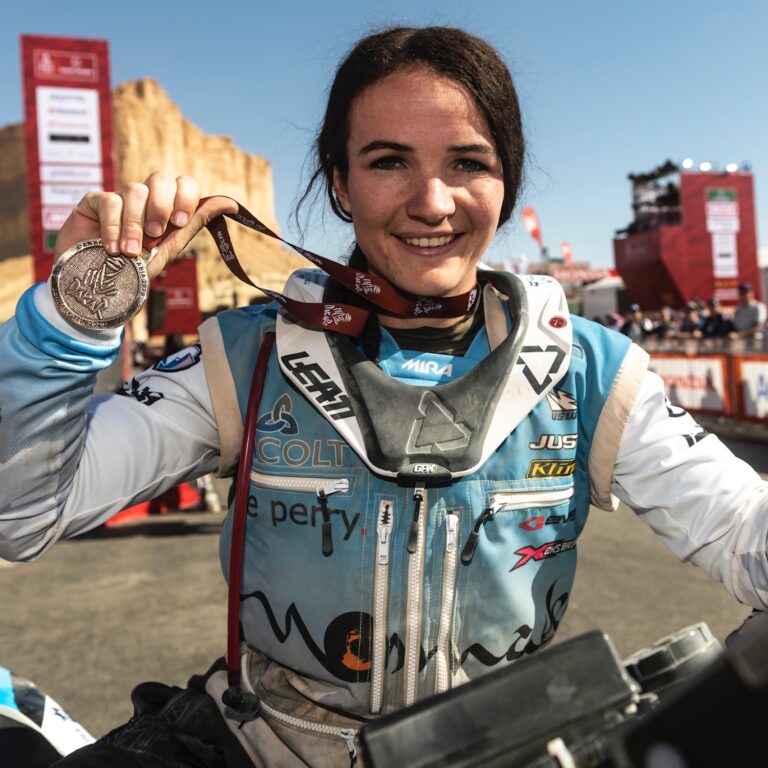 Taye Perry in her race suit