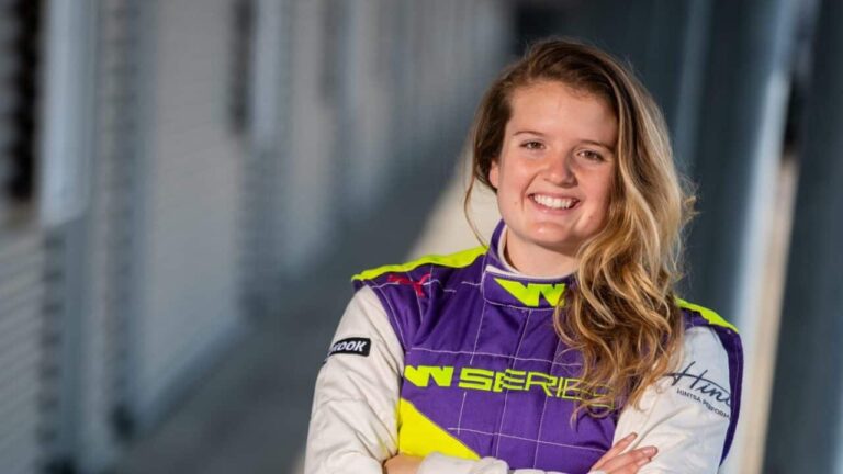 Caitlin May in her race suit